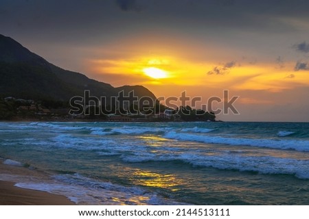 Sunset over the Beau Vallon Beach on the island of Mahe, Seychelles. Beau Vallon Beach is well-frequented and is possibly the most popular beach on the island. Photo stock © 