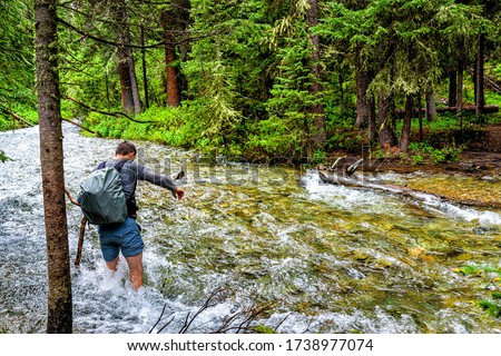 Similar – Image, Stock Photo cross a stream with hiking boots