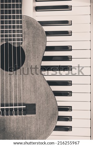 Acoustic Guitar and Piano, old B&W film processed to vintage photo style