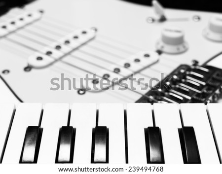 piano / keyboard & electric guitar black and white processed for music background