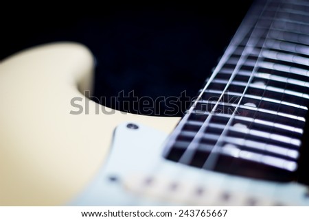 electric guitar focus to fret on fingerboard, shallow depth of field