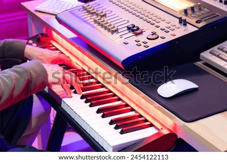 Similar – Image, Stock Photo Hands playing a midi keyboard in a music studio