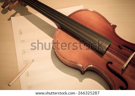 classical Violin on blank Music sheet, soft & dramatic tone processed for music composer concept background