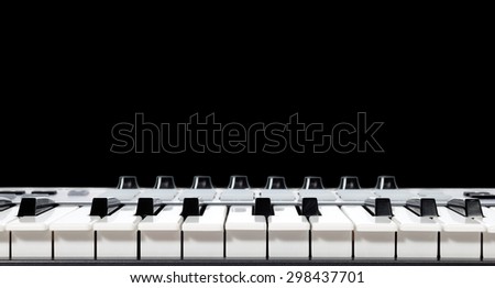 piano,keyboard,synthesizer isolated on black & copy space for music background
