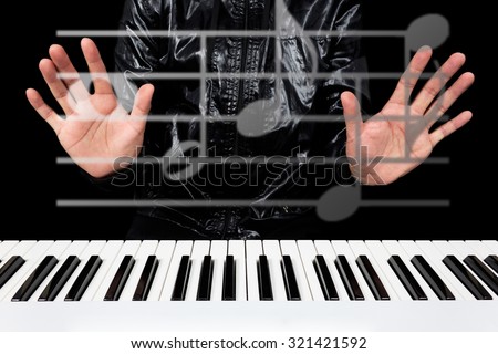 hands of male artist / pianist / musician playing piano and composing music in the imagination isolated on black for music composer technology concept