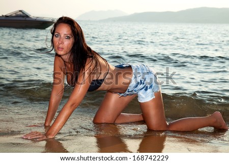 Beautiful girl in hot pants on the beach