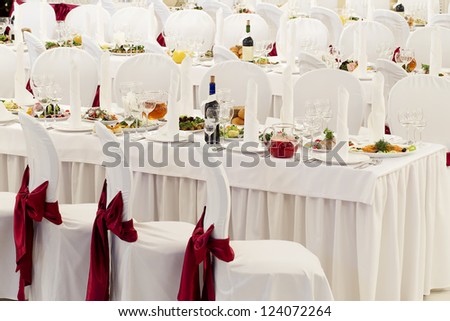 a restaurant banquet room decorated for a wedding party