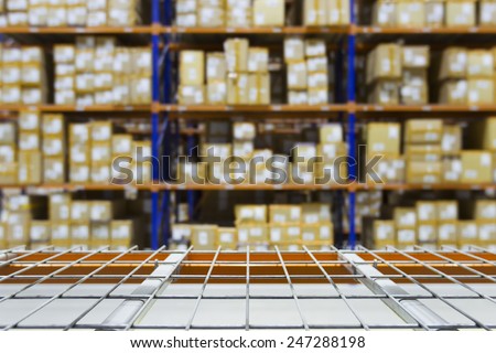 Empty warehouse shelves with defocused background on racking