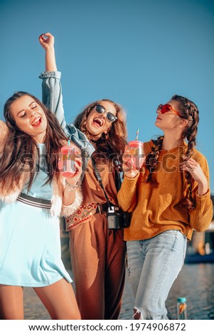 Similar – Image, Stock Photo Best female friends near lake during holiday