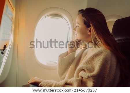 Similar – Image, Stock Photo Passenger looking at flight information board.