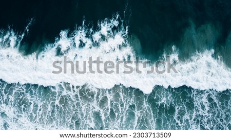Similar – Image, Stock Photo Foamy waves of sea splashing on rocky shore in sunlight