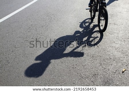 Similar – Image, Stock Photo cyclist shadows on the street in Bilbao city Spain