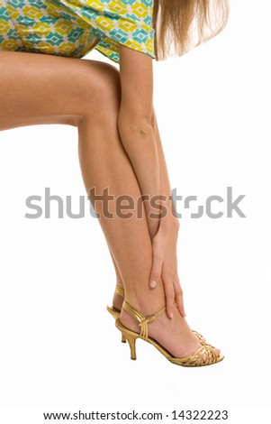 Beautiful legs and arms on high heels isolated on a white background