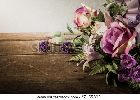 Still life with a beautiful bunch of Flowers with cobweb on wooden table. vintage tone
