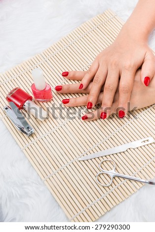 Manicure - Beautiful manicured woman\'s nails with red nail polish