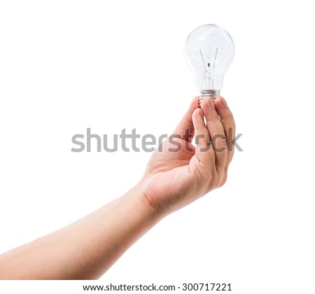 Hand holding an incandescent light bulb isolated on white background with clipping path