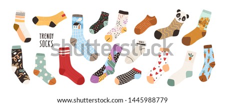 Collection of stylish cotton and woolen socks with different textures isolated on white background. Bundle of trendy clothing items. Modern garment or apparel set. Flat cartoon vector illustration.