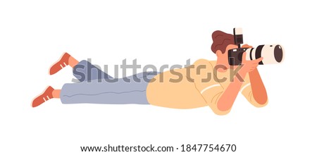 Male photographer lying down and shooting with digital camera. Man reporter holding professional equipment. Scene of working paparazzi. Flat vector cartoon illustration isolated on white background