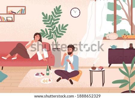Couple enjoy romantic date at home vector flat illustration. Man and woman having dinner with champagne and snack. Male and female sitting on floor and couch. Enamored pair spending time together. 