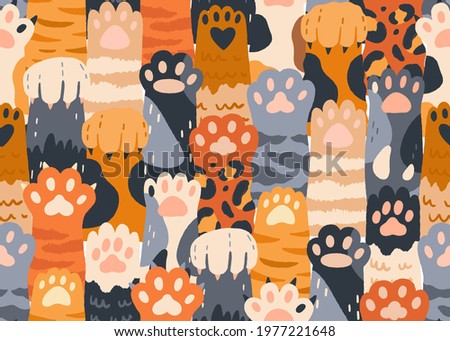 Seamless pattern with cute cat paws raised up together. Repeating background with kitties' hands. Feline animals' crowd. Colored flat vector illustration of endless texture for printing and decoration