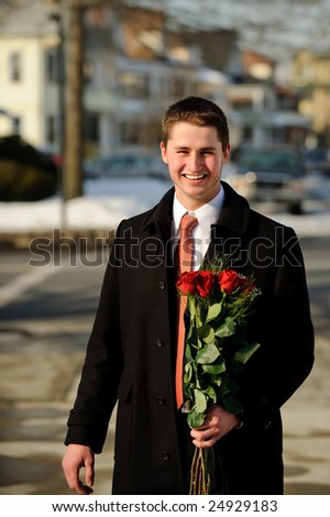 Happy young man with a bouquet
