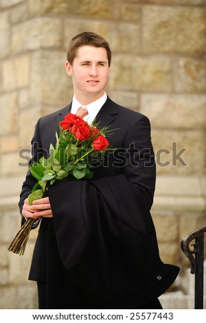 The young man with a bouquet