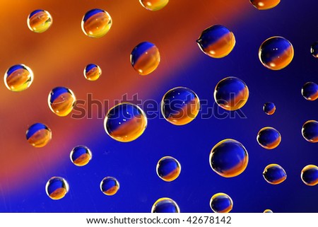 Water drops on a multi-colored background