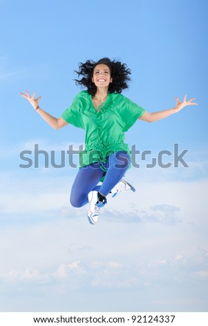 Jumping female dancer in the sky