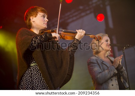 Traena, Norway - July 10 2014: during the concert of the Norwegian folk rock band Hekla Stalstrenga at the Traenafestival, music festival taking place on the small island of Traena.