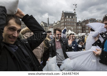 Amsterdam, The Netherlands, Noord Holland - Saturday, April 4 2015 - Pillow Fight on Dam Square as part of the international pillow fight day held in several cities in the world