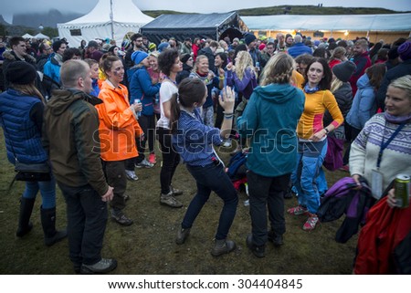 Traena, Norway - July 10 2015: people dancing at the concert of blues world music Tuareg artist Omara 