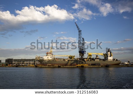 Amsterdam, the Netherlands, August 29, 2015: view of the port of Amsterdam, the biggest cocoa harbour in Europe, with its industrial installation and cranes