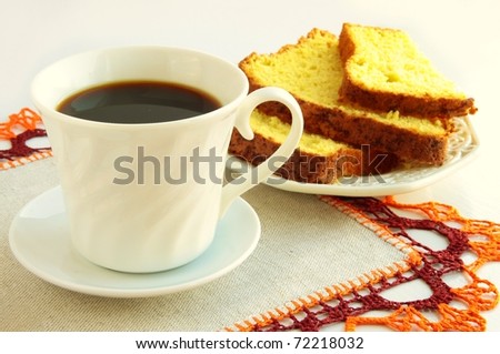cup of coffee and sliced bisquit cake