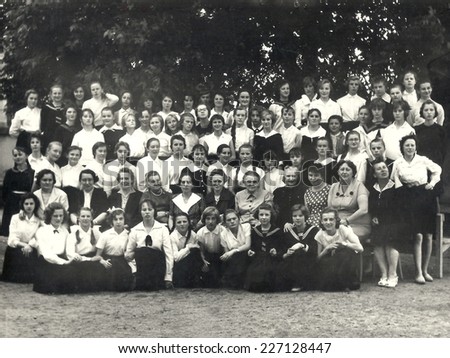 JASLO,POLAND - CIRCA 1960:vintage photo of shool girls with their teachers