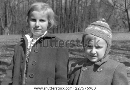 JASLO, POLAND CIRCA 1956 : vintage photo of vintage photo of small girl with her brother