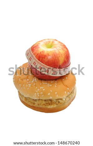 red apple with meter tape and hamburger