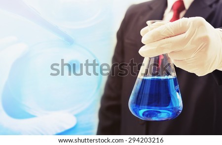 business man research chemistry at science lab