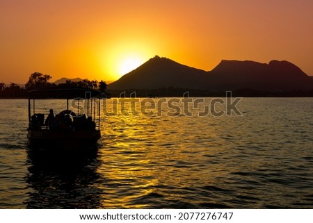 Udaipur lake sunset boat image  Stock fotó © 