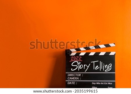 2022 story.hand writing on film slate or movie clapboard for the filmmaker.storytelling concept on multicolor background Stock foto © 