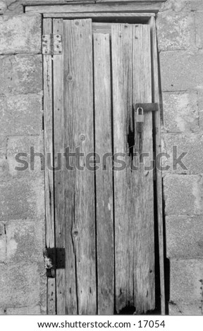 Aged wood door of an old storeroom.