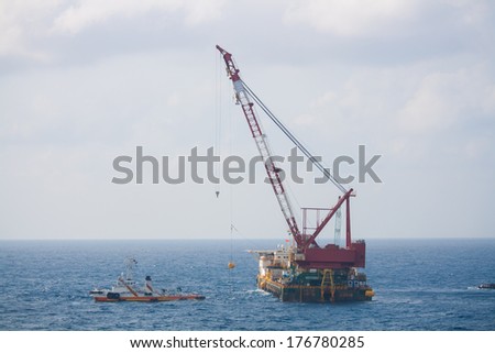 crane barge doing marine heavy lift installation works in the gulf or the sea