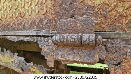 Similar – Image, Stock Photo The rust eats away at the metal plate towards the center. Nothing can stop it.