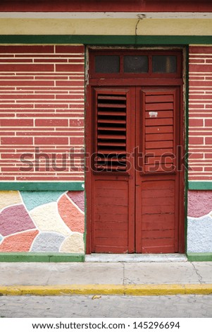 wooden door with shaders in Mexico