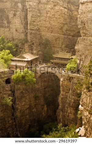 a temple constructed over a deep canyon in China