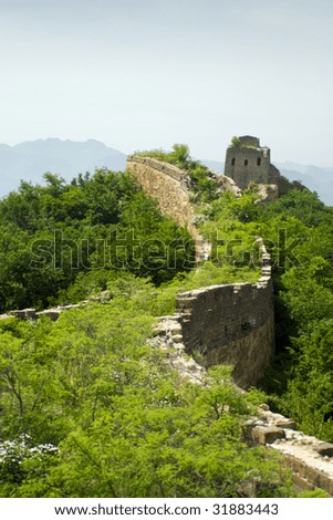 the great wall of china, winding in a S movement on top of a mountain