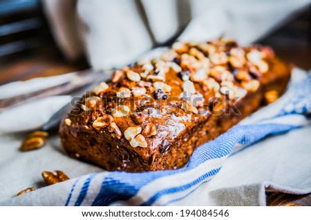 Homemade nut cake on wooden background