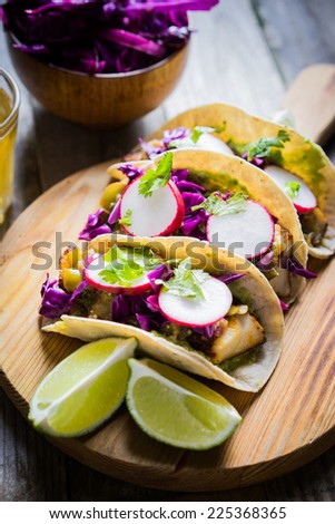 Fish tacos on wooden background
