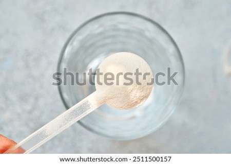 Image, Stock Photo pink plastic scoop and cleaning brush on a yellow background