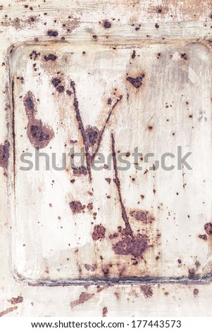 An aged rusty door with brown rust. As years goes by.