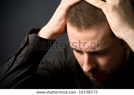 Frustrated businessman - business failure concept (or just a headache)